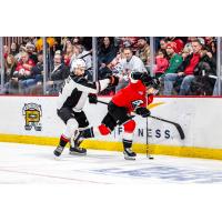 Vancouver Giants defenceman Colton Roberts (left) vs. the Portland Winterhawks