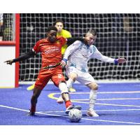 Baltimore Blast defender Oumar Sylla (left) vs. Utica City