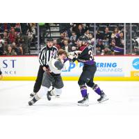 Tucson Roadrunners forward Hunter Drew and Henderson's Joe Fleming drop the gloves