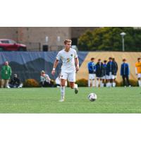 Defender Max Broughton with West Virginia University