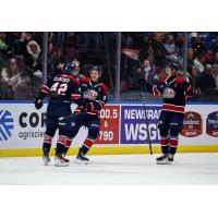 Jacob Cloutier (left) receives congratulations from Saginaw Spirit teammates