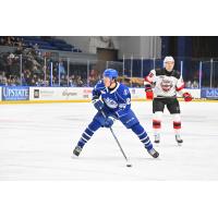 Syracuse Crunch's Logan Brown and Utica Comets' Shane Bowers on the ice