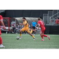 Rhode Island FC midfielder Marc Ybarra with possession vs. Loudoun United FC