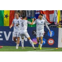 Colorado Springs Switchbacks FC's Matt Mahoney congratulates Marco Micaletto