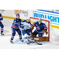 Syracuse Crunch in front of the Rochester Americans goal