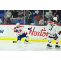 Spokane Chiefs react following a score