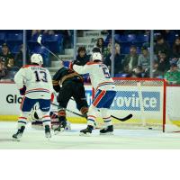Vancouver Giants poke home a goal against the Spokane Chiefs