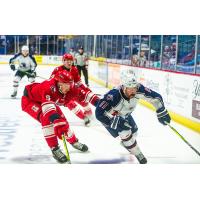 Allen Americans defenseman Hudson Wilson (left) vs. the Tulsa Oilers