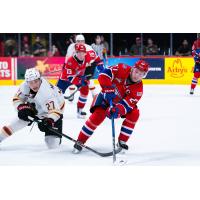Vancouver Giants centre Kyren Gronick (left) vs. the Spokane Chiefs