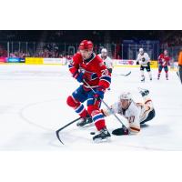 Vancouver Giants center Kyren Gronick attempts to slow the Spokane Chiefs