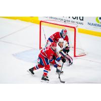 Vancouver Giants right wing Tyus Sparks fights for position by the Spokane Chiefs goal
