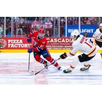 Vancouver Giants left wing Maxim Muranov (right) vs. the Spokane Chiefs