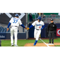 Tulsa Drillers' Cordell Hipolito congratulates John Rhodes